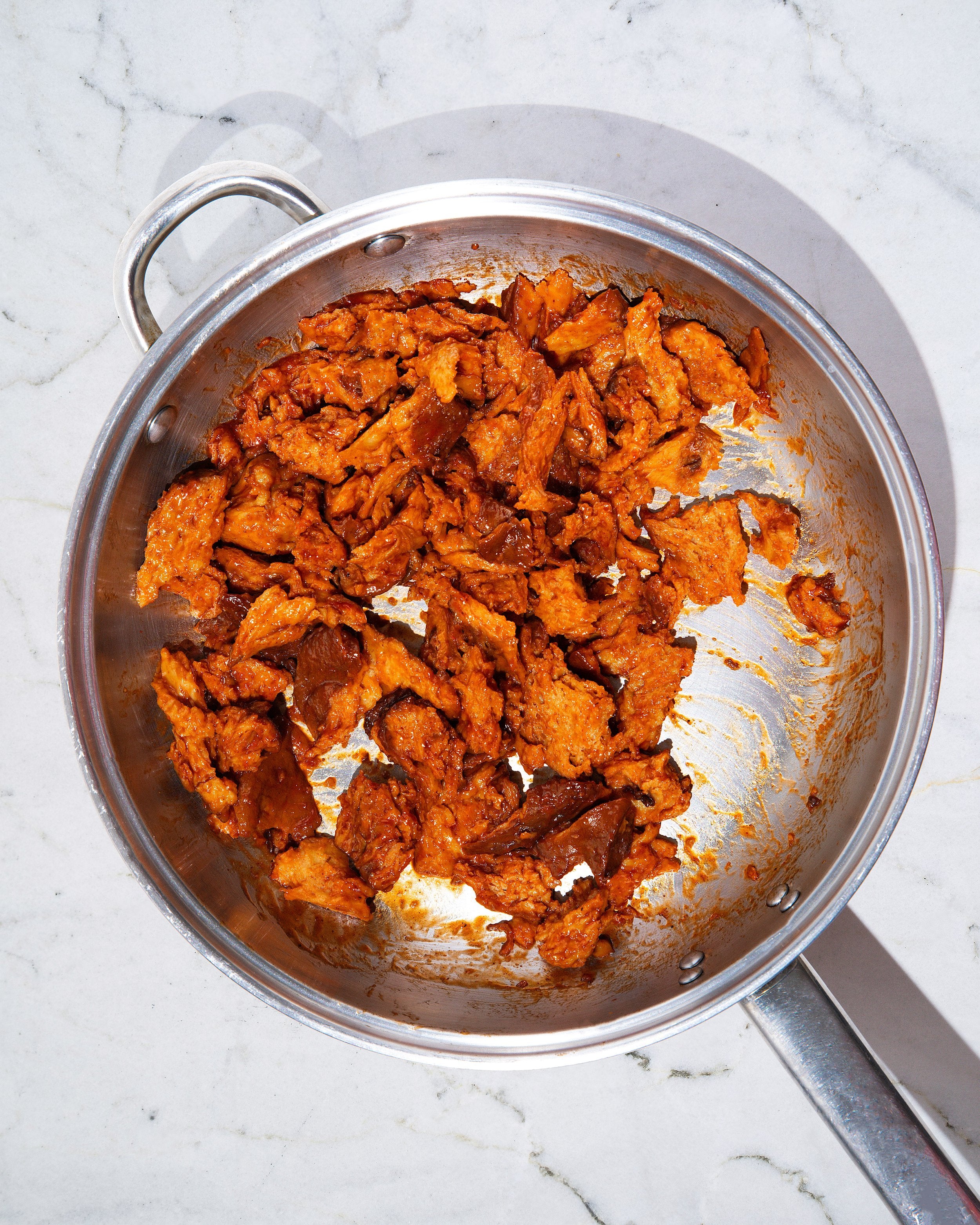 Seitan being sauteed in a skillet